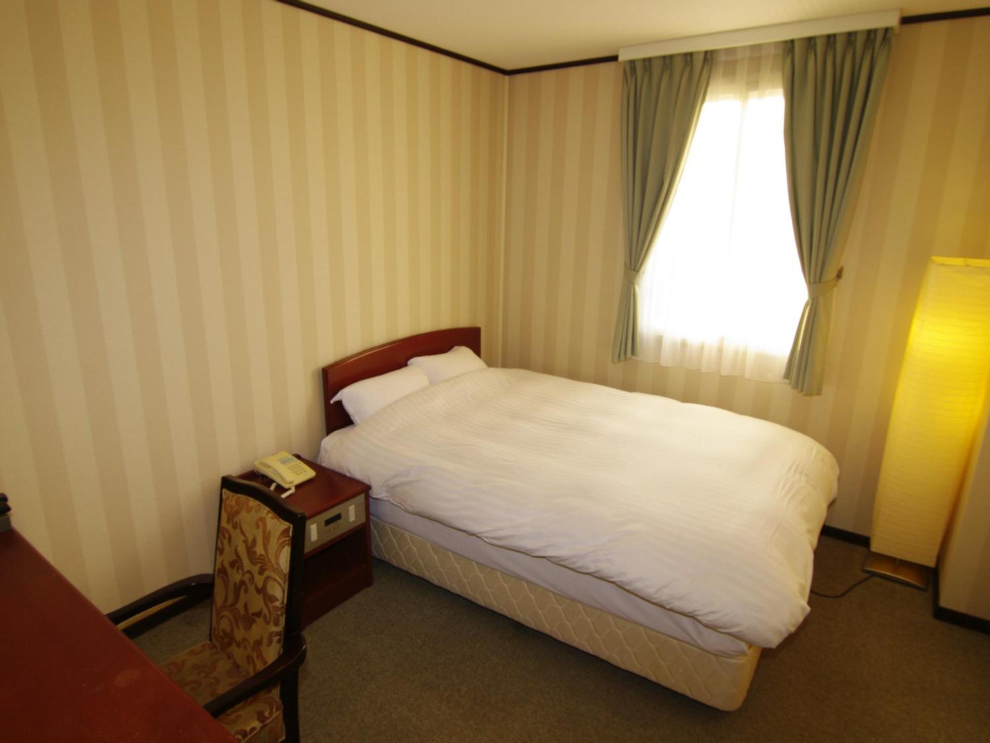 Tsukubanoyu Urban Hotel Quarto foto