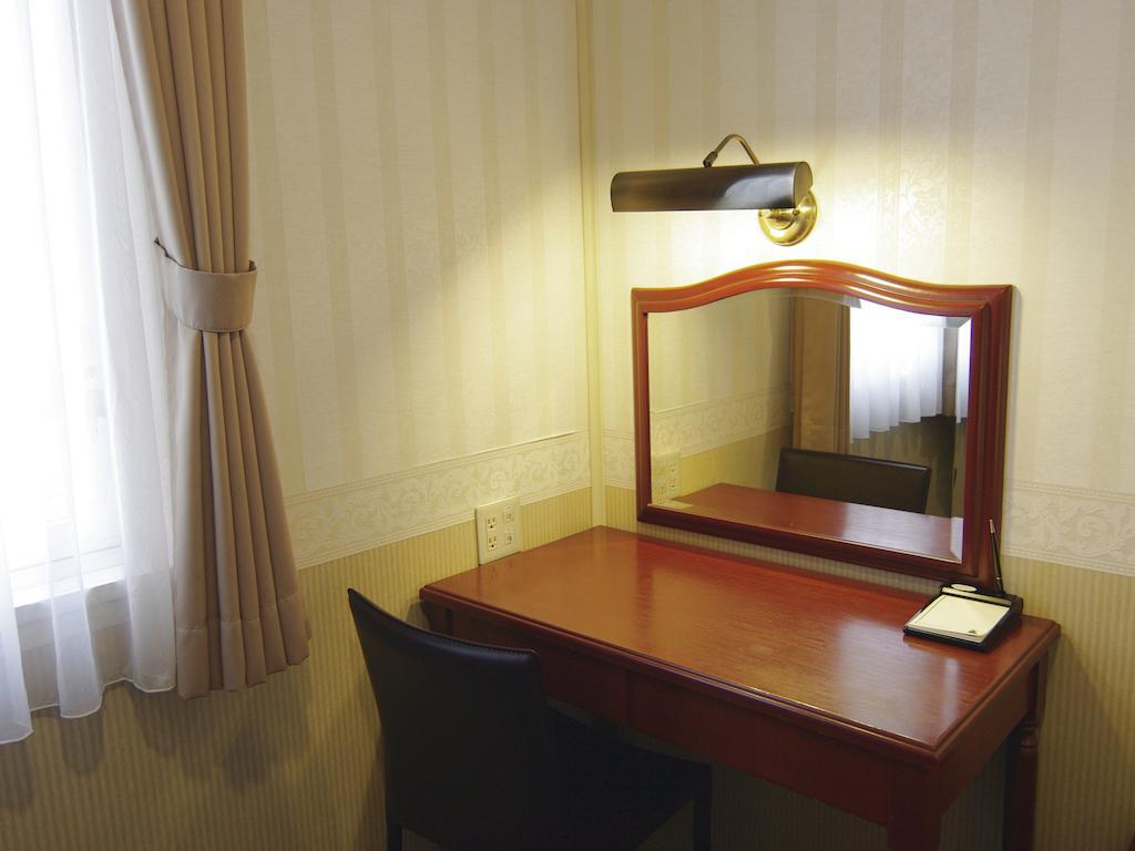 Tsukubanoyu Urban Hotel Quarto foto